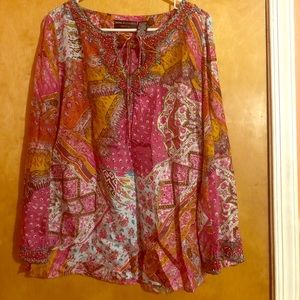 A  multi color blouse long sleeves.